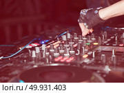 DJ mixes tracks at a party. DJ control panel. Стоковое фото, агентство Ingram Publishing / Фотобанк Лори