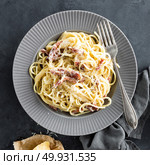 Carbonara pasta, spaghetti with pancetta, egg, hard parmesan cheese and cream sauce. Traditional italian cuisine. Pasta alla carbonara. Стоковое фото, агентство Ingram Publishing / Фотобанк Лори