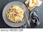 Carbonara pasta, spaghetti with pancetta, egg, hard parmesan cheese and cream sauce. Traditional italian cuisine. Pasta alla carbonara. Стоковое фото, агентство Ingram Publishing / Фотобанк Лори