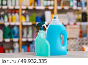 There are liquid detergent, bleaching agent in big capacity package on counter in household shop. Стоковое фото, фотограф Яков Филимонов / Фотобанк Лори
