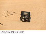 MUI NE - VIETNAM, JANUARY 18, 2016 : Tourists enjoy on the desert by jeep car in Mui ne, January 18, 2016. Редакционное фото, агентство Ingram Publishing / Фотобанк Лори