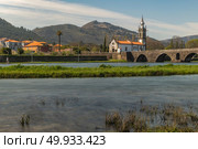 Santo Antonio da Torre Velha church. Santo Antonio da Torre Velha church with roman bridge in Ponte de Lima town, Portugal. Стоковое фото, агентство Ingram Publishing / Фотобанк Лори