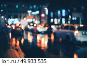 Blurred city at night. Bokeh. Blurred city at night. Bokeh. Beautiful abstract background with defocused buildings, cars, city lights, people. Colorful bokeh background with urban night scene. Design. Concept backdrop. Vintage. Blurred city at night. Bokeh. Стоковое фото, агентство Ingram Publishing / Фотобанк Лори