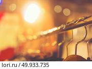 clothes hanger at night market. Стоковое фото, агентство Ingram Publishing / Фотобанк Лори