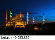 Sultan Ahmed Mosque known as the Blue Mosque is an historic mosque in Istanbul. Inscription on a mosque is translated as On him soul of everyone. Mosque in Istanbul. Mosque in Istanbul. Стоковое фото, агентство Ingram Publishing / Фотобанк Лори