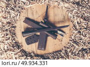 Carpenter tools on wooden table with sawdust. Carpenter workplace top view. Стоковое фото, агентство Ingram Publishing / Фотобанк Лори