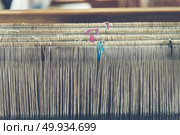 old weaving loom with Hand-woven cotton, vintage filter image. Стоковое фото, агентство Ingram Publishing / Фотобанк Лори