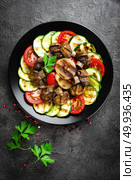 Salad with fresh and grilled vegetables and mushrooms. Vegetable salad with grilled champignons. Vegetable salad on plate. Стоковое фото, агентство Ingram Publishing / Фотобанк Лори