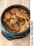 Gamjatang Korean Spicy Pork rib Soup with Kimchi and udon. Стоковое фото, агентство Ingram Publishing / Фотобанк Лори