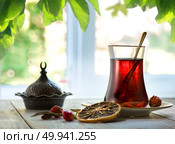 Compostion with fresh turkish tea on a background of window. Стоковое фото, агентство Ingram Publishing / Фотобанк Лори