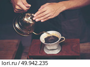 coffee dripping process, vintage filter image. Стоковое фото, агентство Ingram Publishing / Фотобанк Лори