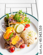 grilled beef skewer with fried rice. Стоковое фото, агентство Ingram Publishing / Фотобанк Лори