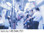 Abstract Blur image of people inside Mass Rapid Transit (MRT) subway train, Singapore. Стоковое фото, агентство Ingram Publishing / Фотобанк Лори
