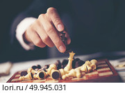 Businessman play with chess game. concept of business strategy and tactic. Стоковое фото, агентство Ingram Publishing / Фотобанк Лори