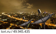Satellite dish at Bangkok city night view. Стоковое фото, агентство Ingram Publishing / Фотобанк Лори