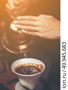 Drip brewing, filtered coffee, or pour-over is a method which involves pouring water over roasted, ground coffee beans contained in a filter. Стоковое фото, агентство Ingram Publishing / Фотобанк Лори