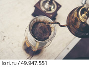 coffee drip process, vintage filter image, slow bar. Стоковое фото, агентство Ingram Publishing / Фотобанк Лори
