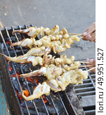 seafood barbecue of grilled squid on charcoal oven. Стоковое фото, агентство Ingram Publishing / Фотобанк Лори
