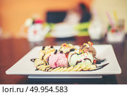 ice cream sundae vanilla strawberry chocolate lemon scoops with banana.. ice cream sundae vanilla strawberry chocolate lemon scoops with . Стоковое фото, агентство Ingram Publishing / Фотобанк Лори