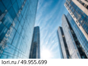 Modern Skyscrapers Reach Towards a Vibrant Blue Sky With Soft Clouds in the Background. Стоковое фото, фотограф Aleksandr Golubev / Фотобанк Лори