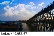 The wooden bridge is the second longest in the world. at Sangklaburi in Kanchanaburi, Thailand. The wooden bridge is the second longest in the world. at Sangkla. Стоковое фото, агентство Ingram Publishing / Фотобанк Лори