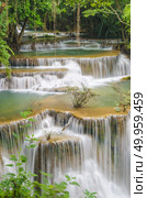 Huay Mae Kamin Waterfall at Kanchanaburi province, Thailand. Стоковое фото, агентство Ingram Publishing / Фотобанк Лори