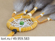 colorful dreamcatcher on brown vintage background. Стоковое фото, агентство Ingram Publishing / Фотобанк Лори
