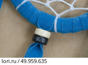 blue dreamcatcher on brown background. Стоковое фото, агентство Ingram Publishing / Фотобанк Лори