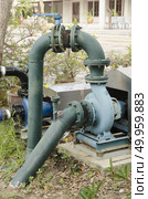 water pumping on the ground field. Стоковое фото, агентство Ingram Publishing / Фотобанк Лори