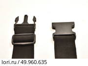black plastic buckle on strap isolated on white. Стоковое фото, агентство Ingram Publishing / Фотобанк Лори