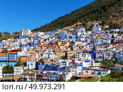 Picturesque view of city of blue Chefchaouen on a sunny summer day. Morocco. Стоковое фото, фотограф Евгений Ткачёв / Фотобанк Лори