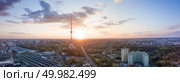 Kyiv evening panoramic view. Modern illuminated TV tower in the middle of composition. Drone photography from aerial view. Panoramic view of the city with a TV tower in Kiev, Ukraine on a beautiful sunset. Стоковое фото, агентство Ingram Publishing / Фотобанк Лори