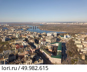 Vozdvizhenka District, the Museum of the History of Kiev, the Alexander Church and in the distance Obolon District with the Dnieper River and a bridge that connects the two banks of the city of Kiev, Ukraine. Photo from the drone. view landscape in Kiev with Vozdvizhenka District, the Museum of the History of Kiev, the Alexander Church and in the distance Obolon District. Стоковое фото, агентство Ingram Publishing / Фотобанк Лори