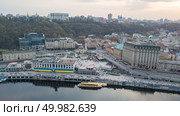 Aerial view of the Port with a tourist boat, Podil and Postal Square with St. Elijah Church in Kiev, the capital of Ukraine. Photo by drone. Aerial view of River Port, Podil and Postal Square in Kiev, the capital of Ukraine. Стоковое фото, агентство Ingram Publishing / Фотобанк Лори