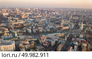 Sofievskaya Tower and the square, St. Michael’s Cathedral, the city center, Vladimirsky Proyezd and the Olympic stadium in the distance in Kyiv, Ukraine. Photo by drone. Sophia Tower and square, city center and Olympic Stadium in the city of Kiev. Стоковое фото, агентство Ingram Publishing / Фотобанк Лори