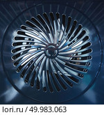 Close-up of a metal fan. Inside An empty metal modern stove with convection.. Close-up of metal fan. Inside the furnace. Стоковое фото, агентство Ingram Publishing / Фотобанк Лори