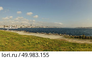 Embankment of straint Bosphorus in Istanbul, on a sunny day.The city of Istanbul is far away. Turkey. Embankment of straint Bosphorus in Istanbul, Turkey. Стоковое фото, агентство Ingram Publishing / Фотобанк Лори
