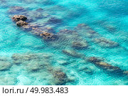 Top view of transparent shallow turquoise ocean sea water surface and rock at andaman sea indian ocean in summer. Стоковое фото, агентство Ingram Publishing / Фотобанк Лори