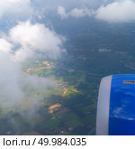 Clouds and sky as seen through window of an aircraft,. View from plane window. Стоковое фото, агентство Ingram Publishing / Фотобанк Лори