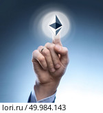 hand man touch the ripple icon on the web screen,concept cryptocurrency.technology concept.. hand man touch the ripple icon. Стоковое фото, агентство Ingram Publishing / Фотобанк Лори