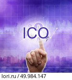 ICO (primary coin placement) concept. Different icons cryptocurrency: Litecoin, etherium, ripple, bitcoin and hand touches the abbreviation ICO on virtual screen on an ultra violet background of a modern city. Fundraising to launch or develop projects in the long term.. Different icons cryptocurrency: Litecoin, etherium, ripple, bitcoin and hand touches the abbreviation ICO on the ultraviolet background of the city. Стоковое фото, агентство Ingram Publishing / Фотобанк Лори