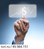 hand of a man pushing virtual online button with dollar icon,currency graph. hand of a man pushing virtual online button with dollar icon. Стоковое фото, агентство Ingram Publishing / Фотобанк Лори