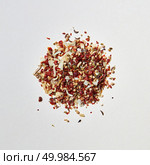 A mix of flavoring spices for the cooking of natural organic homemade food. Food and cuisine ingredients on a white with copy space. Flat lay. Colorful pattern of a mixed of fragrant natural spices for cooking meat on a white background. Стоковое фото, агентство Ingram Publishing / Фотобанк Лори