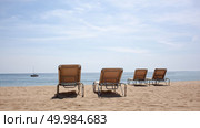 Four beach chairs on the beach. Spain, Barcelona beach. Four beach chairs on the beach. Стоковое фото, агентство Ingram Publishing / Фотобанк Лори