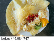 Exotic Fruit crape with ice cream. Стоковое фото, агентство Ingram Publishing / Фотобанк Лори