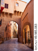 Arches of Barrio Calatrava Los Patios in Majorca at Palma de Mallorca, Spain.. View on Palma de Mallorca. Стоковое фото, агентство Ingram Publishing / Фотобанк Лори