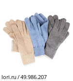 many colored gloves. Winter accessories isolated on white background.. three pairs of knitted gloves. Стоковое фото, агентство Ingram Publishing / Фотобанк Лори