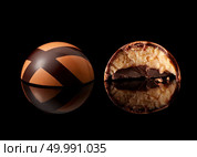 tasty yellow chocolate candy on a black background. chocolate candy on black background. Стоковое фото, агентство Ingram Publishing / Фотобанк Лори