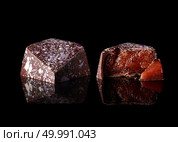 tasty yellow chocolate candy on a black background. chocolate candy on black background. Стоковое фото, агентство Ingram Publishing / Фотобанк Лори