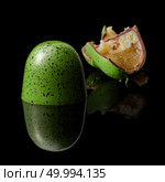 delicious green chocolate candy on a black background. chocolate candy on black background. Стоковое фото, агентство Ingram Publishing / Фотобанк Лори
